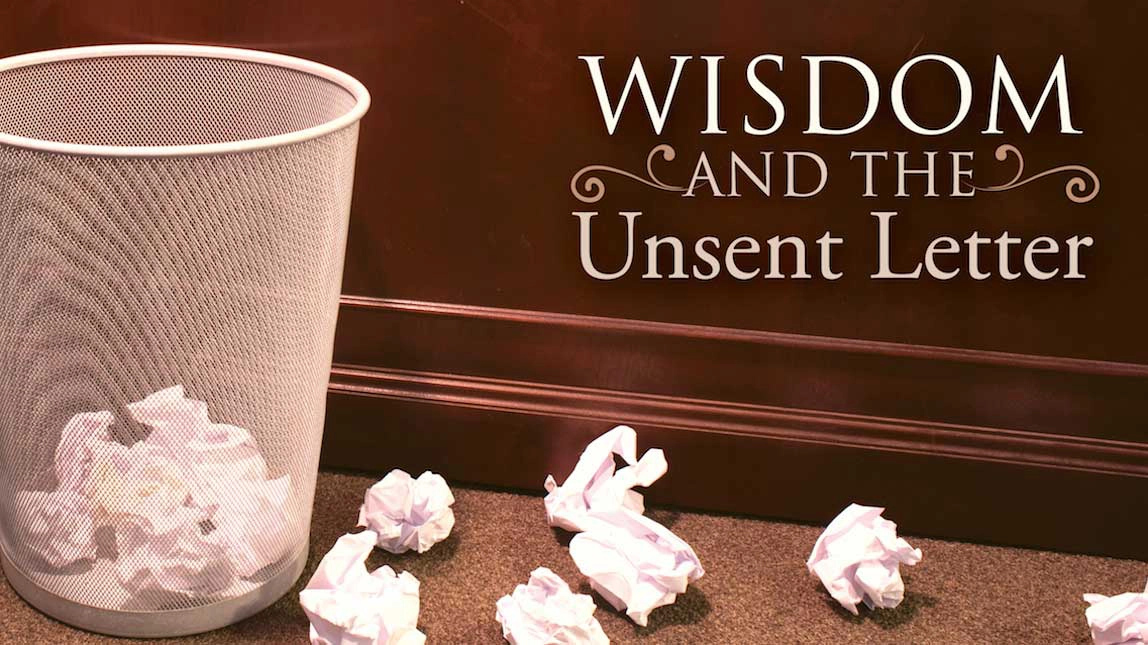 Trash can with crumpled white papers