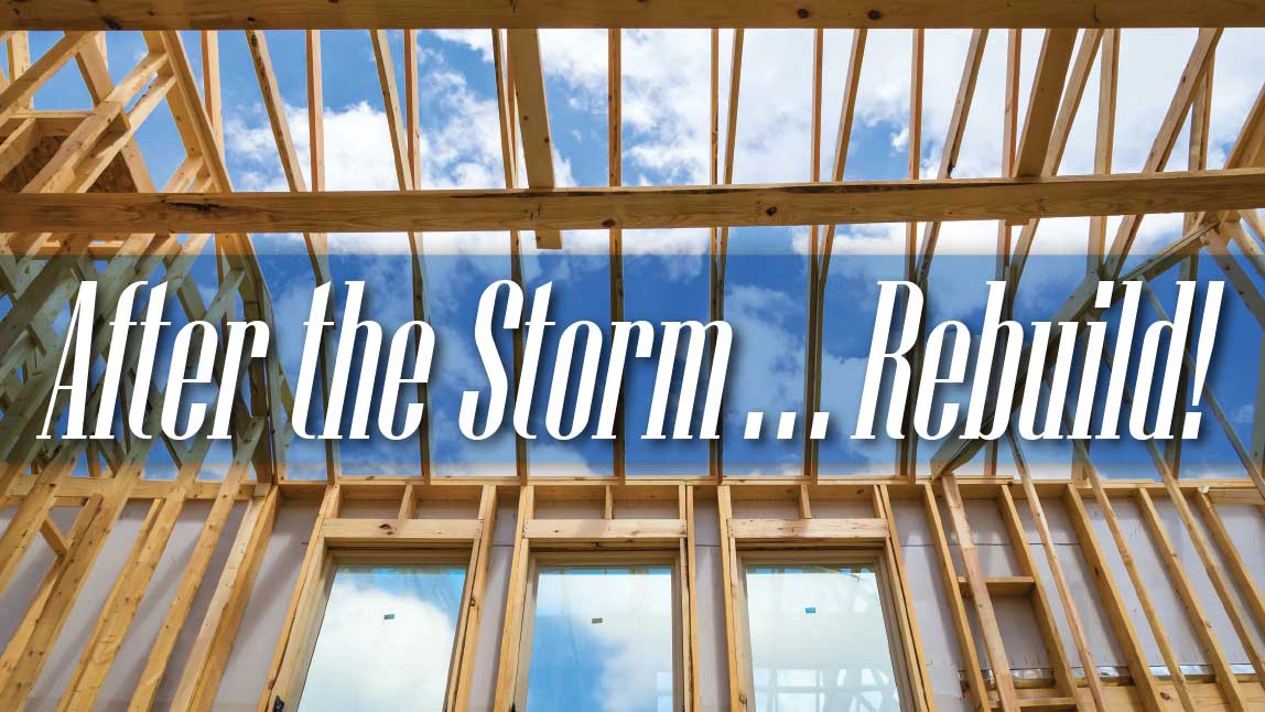 View from the floor of a house under construction with a blue sky and clouds