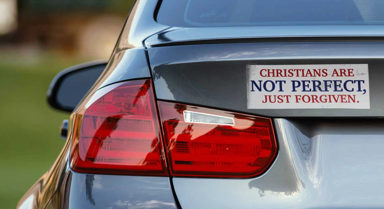 A car with a bumper sticker with the words "Christians are Not Perfect, Just Forgiven."