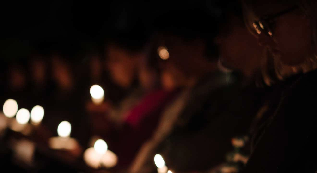 Blurred view of candles in a dark room