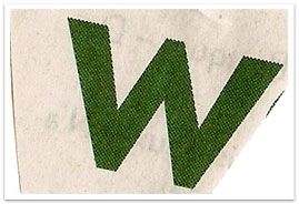 A closeup of a large fabric letter W