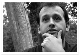 A man holding his chin with his left hand