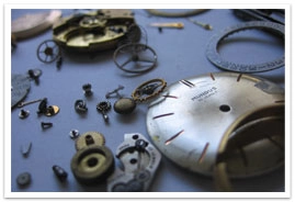 Pieces of a clock on a table