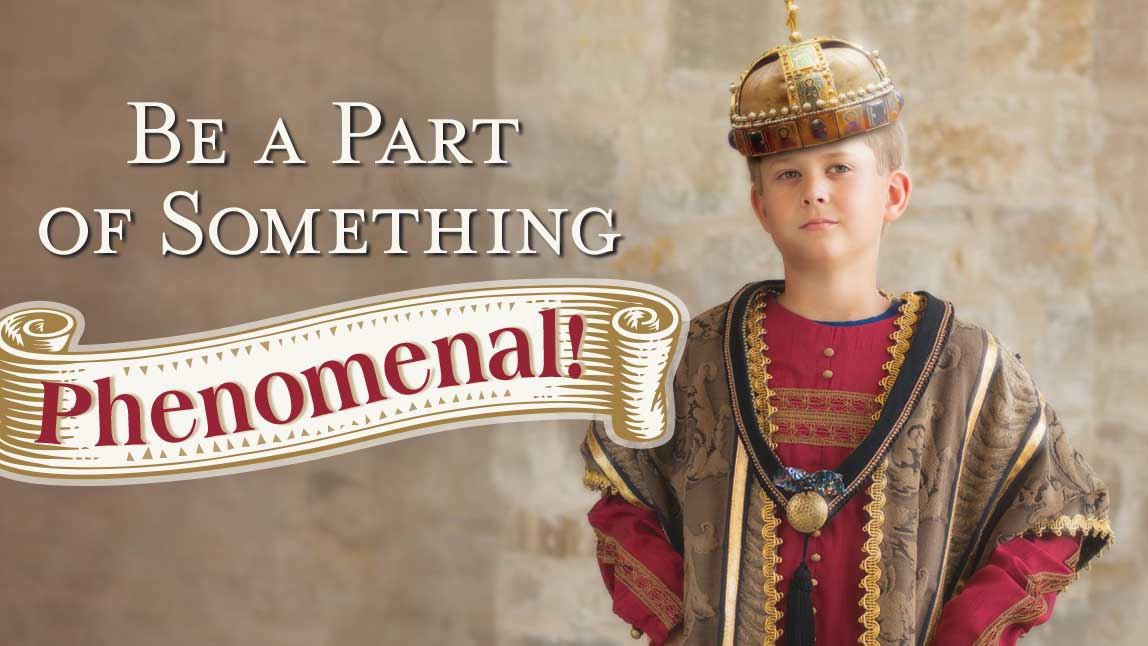 Young boy with royal robe and crown