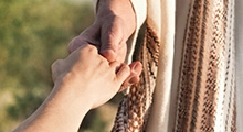 Jesus holding a women's hand