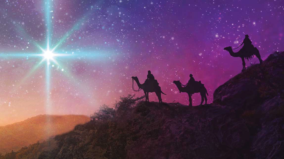 Three men mounted on camels at night following a great star