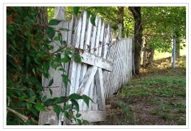 An old wooden fence in need of repair