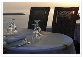 A table sitting outside near the water