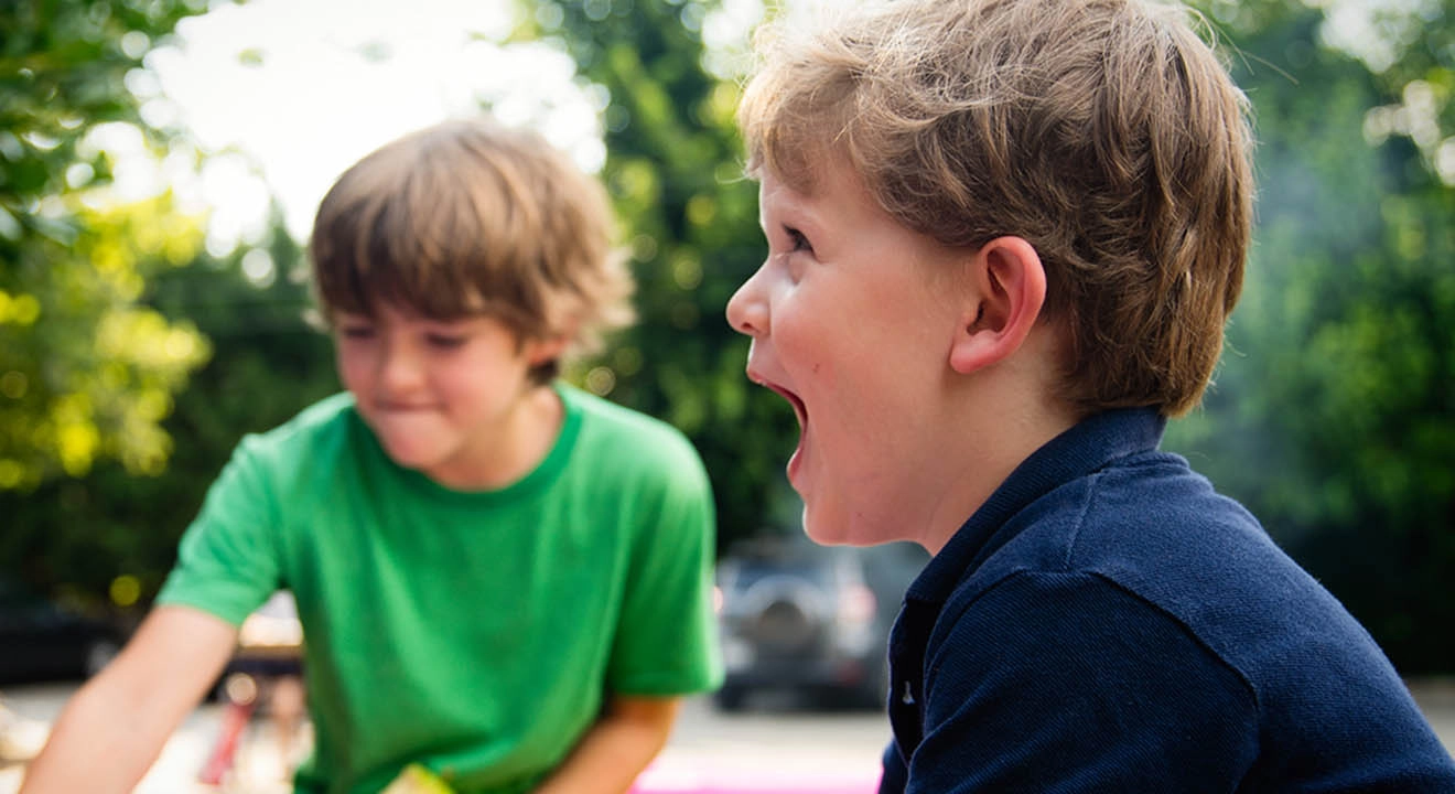 Two boys playing outside