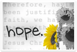 Typed word hope in front of sunflowers