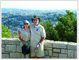 Bryant Kelley and his wife standing in the foreground with Jerusalem in the background