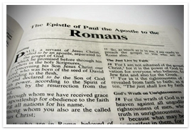 A Bible opened to the book of Romans